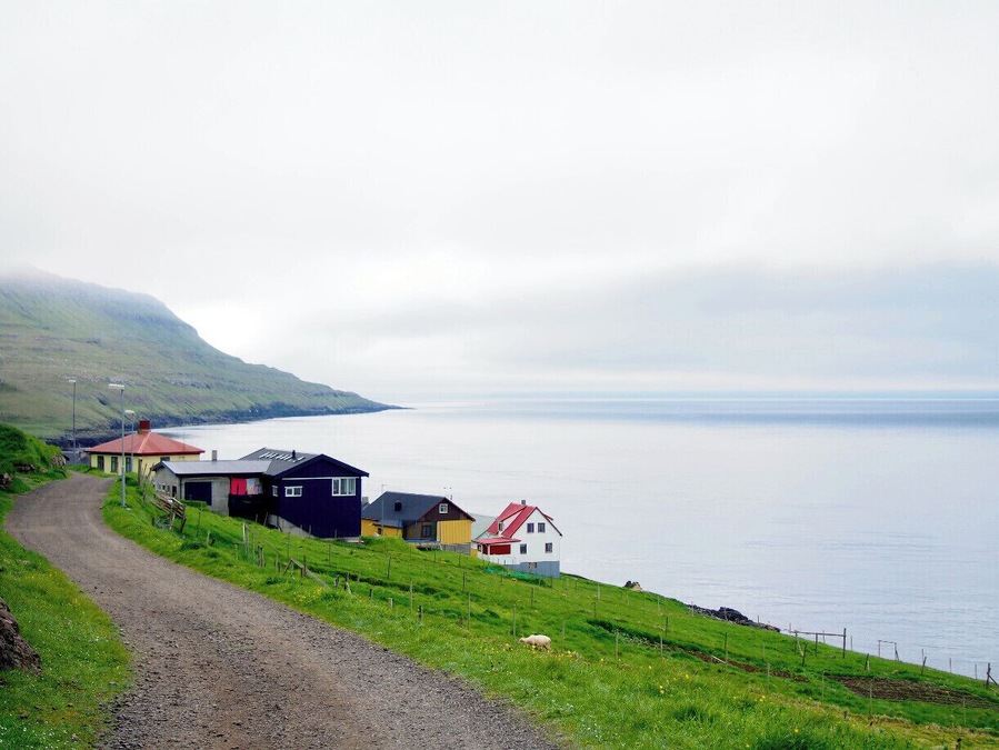The Faroese village of Nólsoy is a mere 20-minute ferry ride from the capital city of Tórshavn. At only 20 kr each way and with several ferries sailing to and from the island each day, it makes for a great day trip. #TroverDetour