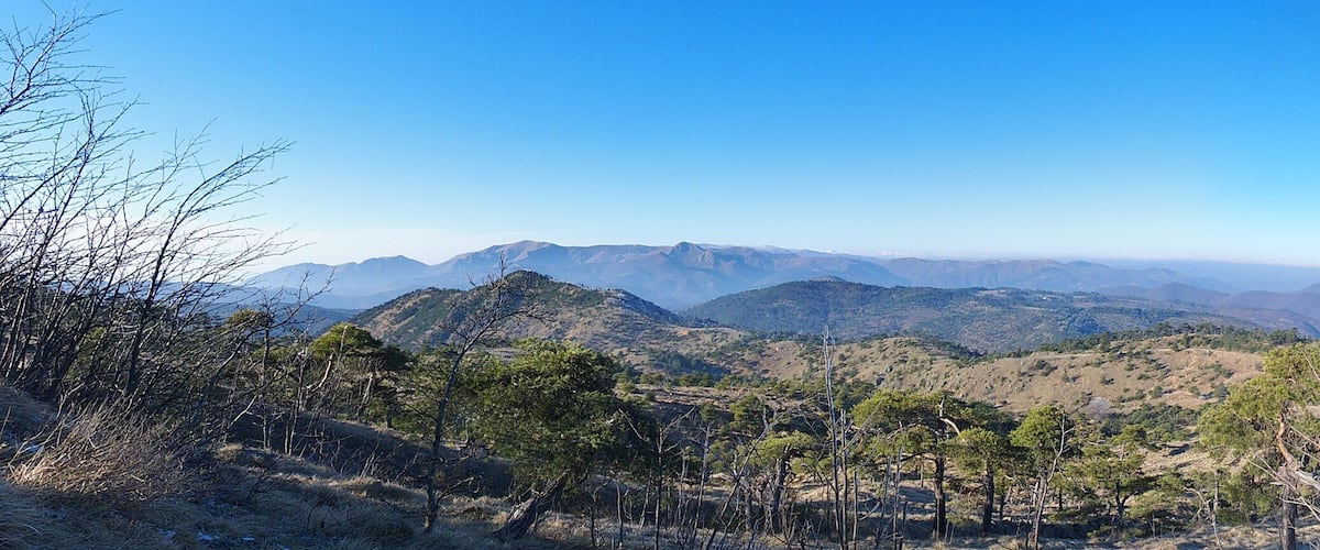 A mountainous landscape with clear skies.