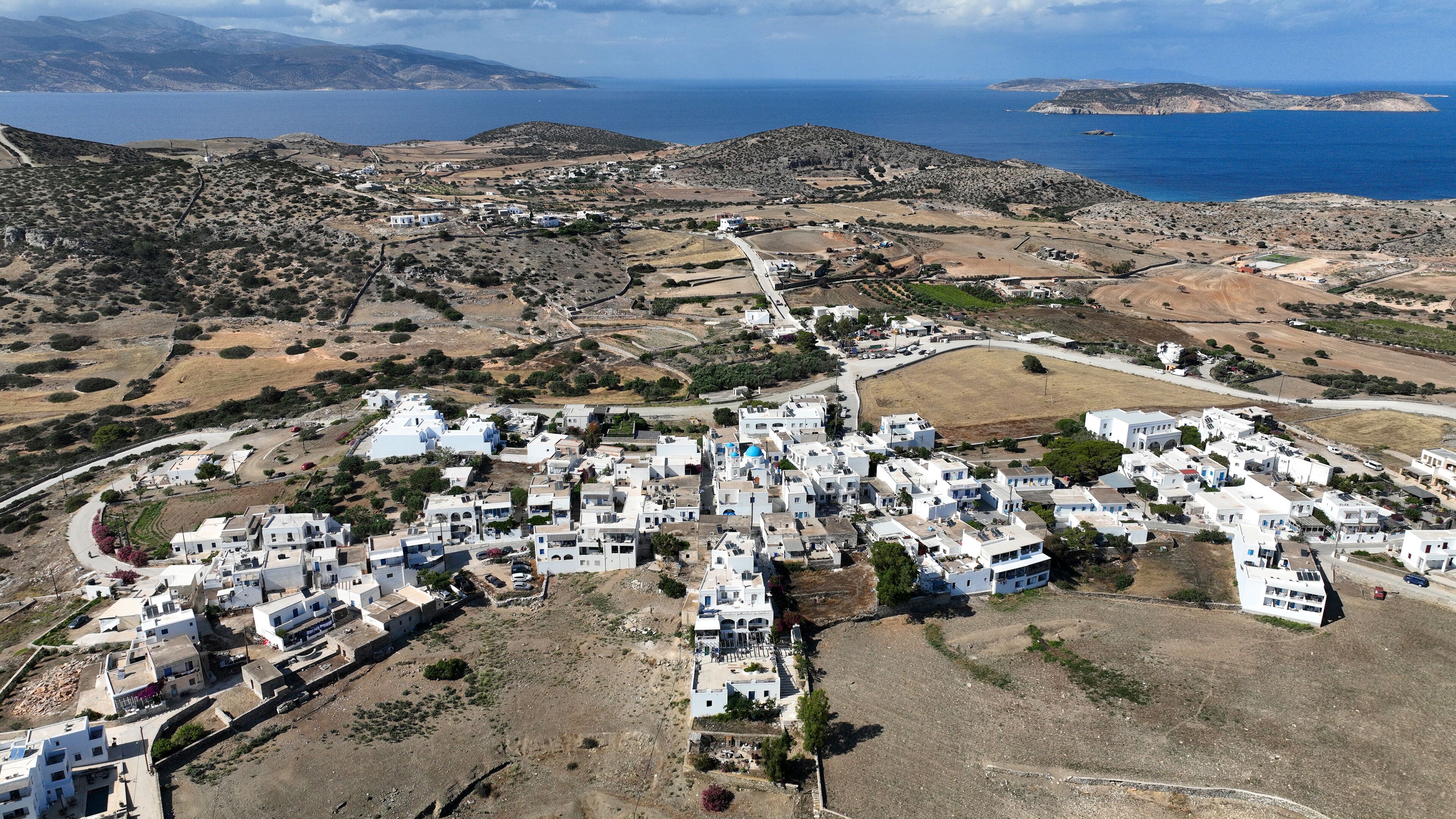 Aerial drone photo of small picturesque main town in island of Schoinousa, small Cyclades, Greece