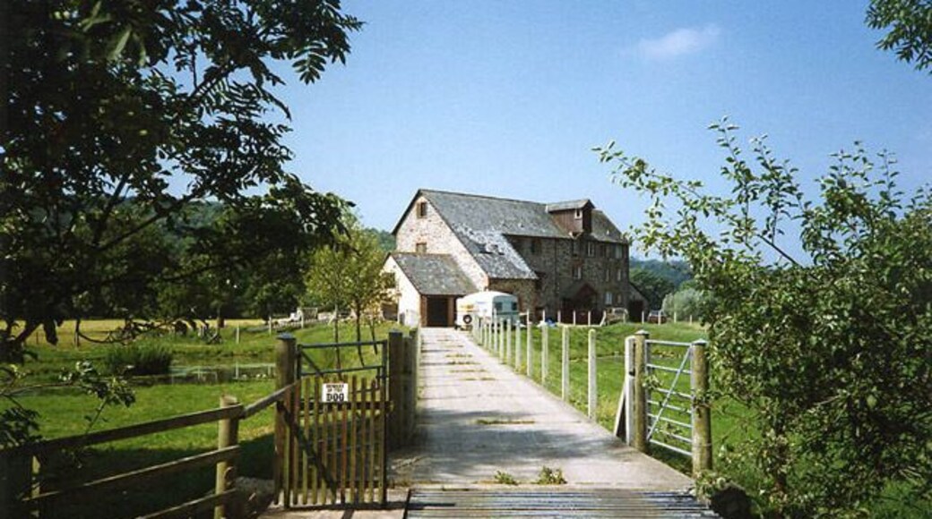 Weare Giffard: Wear Mills. On a leat by the river Torridge; in the 18th and 19th century barges would bring grain on the top of the tide from Bideford. By 1889 the mill was fitted with a turbine and roller milling machinery by Henry Simon of Manchester; the turbine was appropriate as the Torridge is liable to flood. The mill has been converted to a private residence