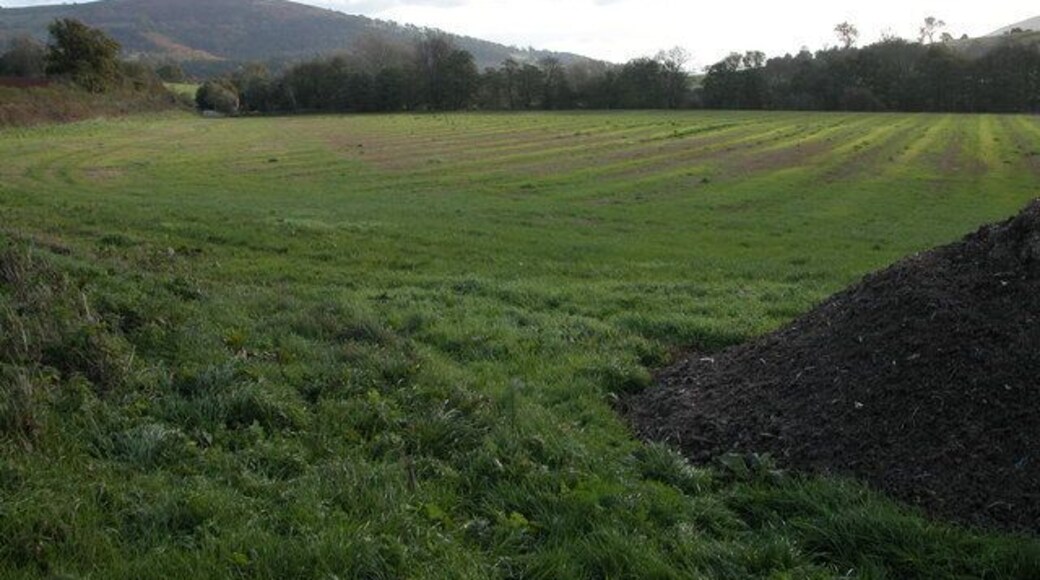 Farmland at Kentchurch The line of trees on the far side of the field indicates the route of the river Monnow which is also the boundary between England and wales. Wales is on the opposite side of the river. The hill in the background is Garway Hill.