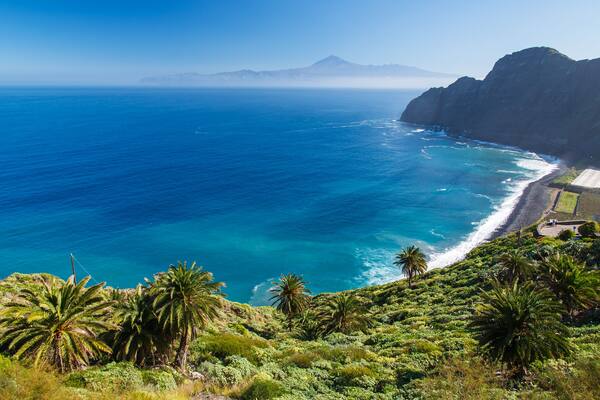View of Santa Catalina beach and mountains with Tenerife island in the background, La Gomera island; Shutterstock ID 135816515; purchase_order: -; Order: -; client: -; job: -