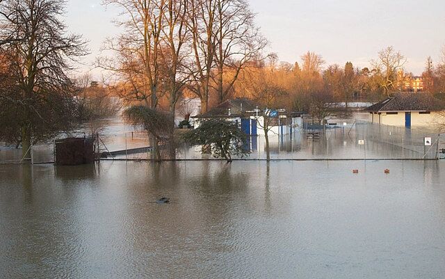 Anyone for a swim This is from the 2003 floods and shows how high the river came, the building you see is the changing rooms for the swimming pool which as you can see is under water and is a few metres in front of it. Round where the black bag is in the middle of the photo is a children's paddling pool, they would need scuba gear to find it.