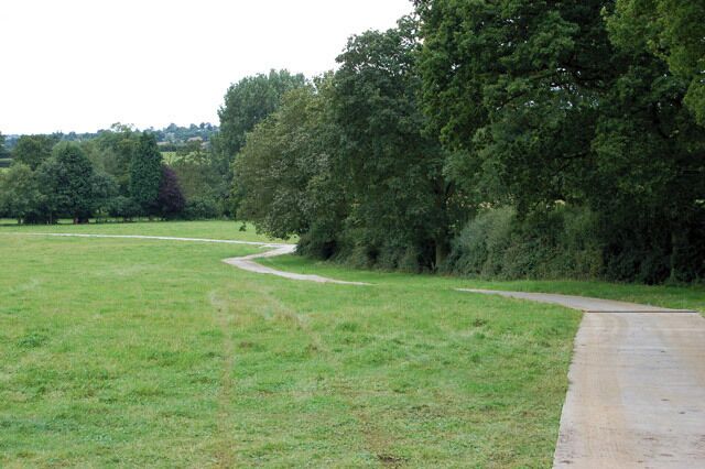 Festival preparations at Cropredy (7) Looking south across a field used to stage Fairport's Cropredy Convention music festival every August. A sectional 'Takway' metal road has been laid as part of the preparations. The pasture on the left of the photo is the main concert arena during the festival.