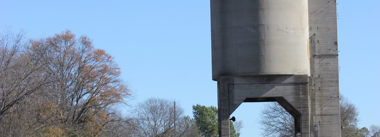The old Georgia Railroad coaling tower. These towers were back in the day of steam locomotives. The tracks are still in use by CSX Railroad.