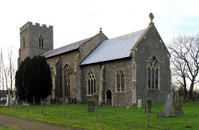A stone church with a tower and arched windows.