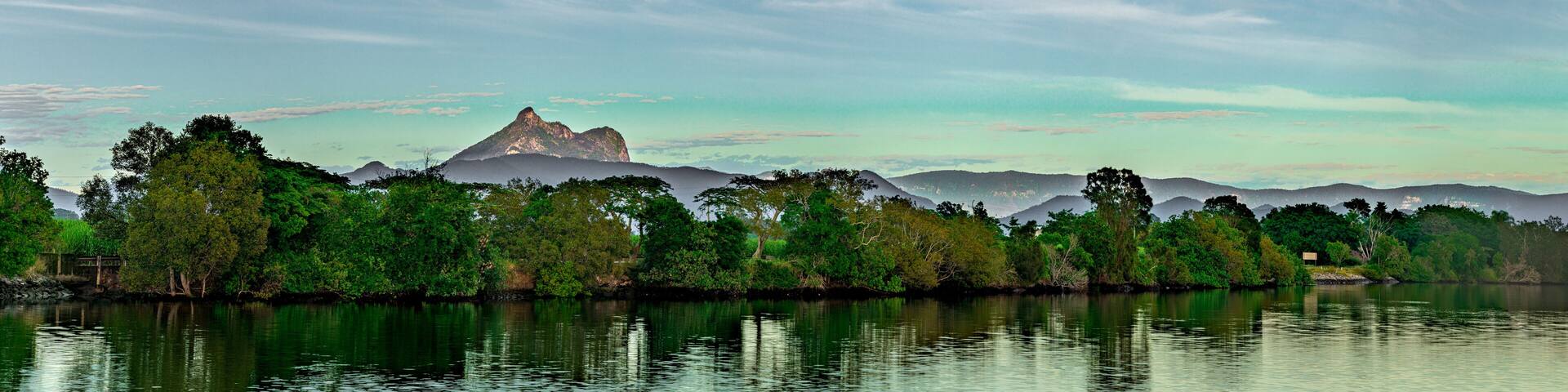 Wide panorama of Mt Warning and Tweed River at sunrise near Tumbulgum NSW Australia