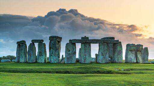 Stonehenge standing against a dramatic sky.