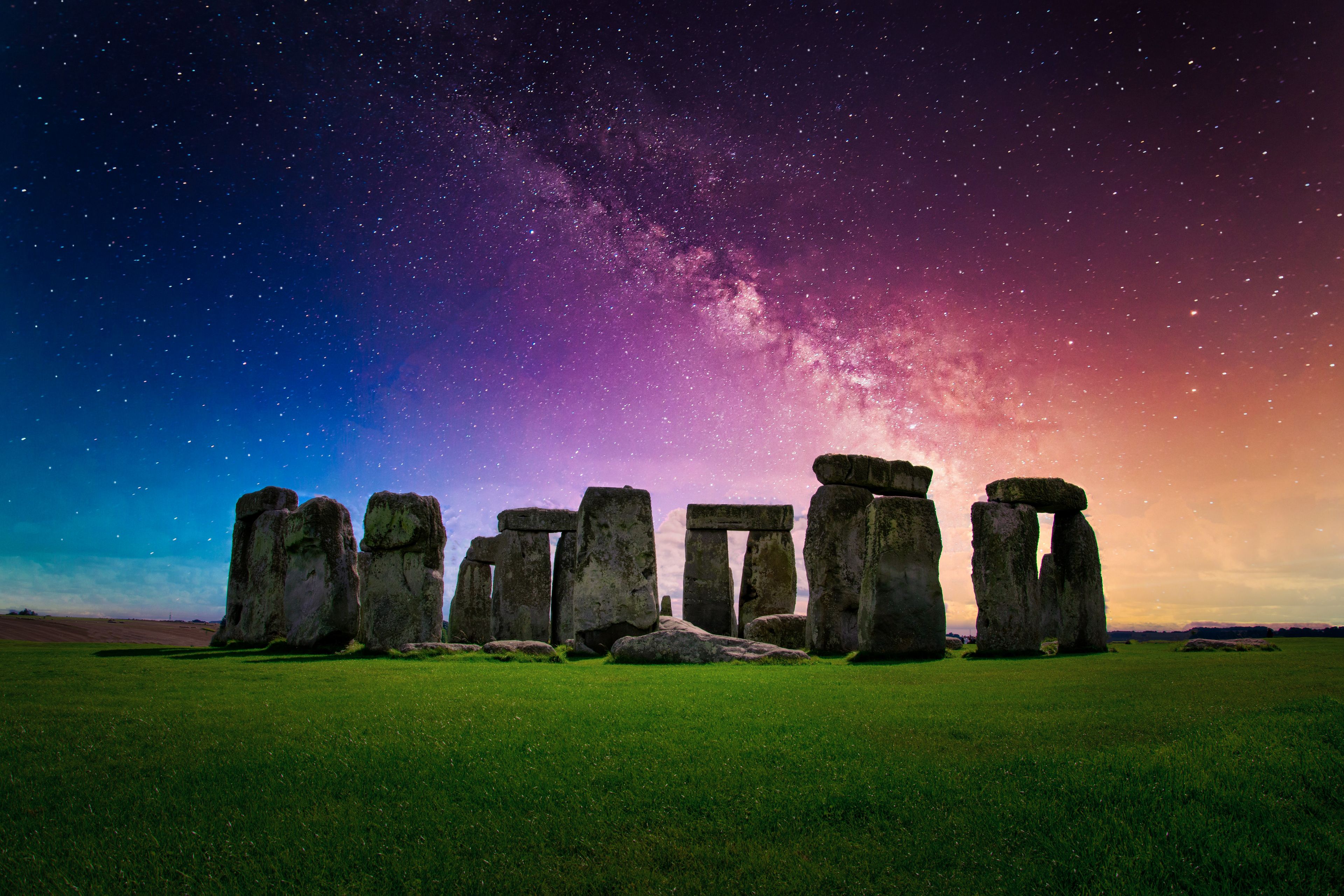Landscape image of Milky way galaxy at night sky with stars over Stonehenge an ancient prehistoric stone monument, Wiltshire, UK.