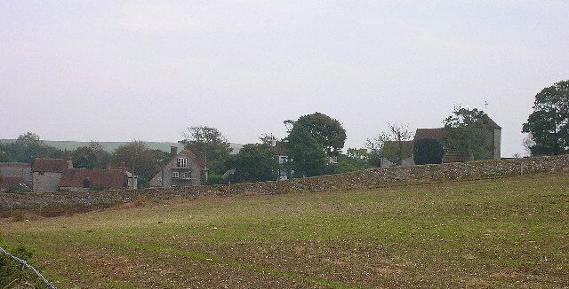 Ovingdean. View south from the bridleway that takes Ovingdean's 11th century church and accompanying flint built buildings. Much of the old village uses the same material for house building a legacy of the 18th century when old wooden structures were replaced with stone buildings sourced from whatever could be found locally and in great quantities.