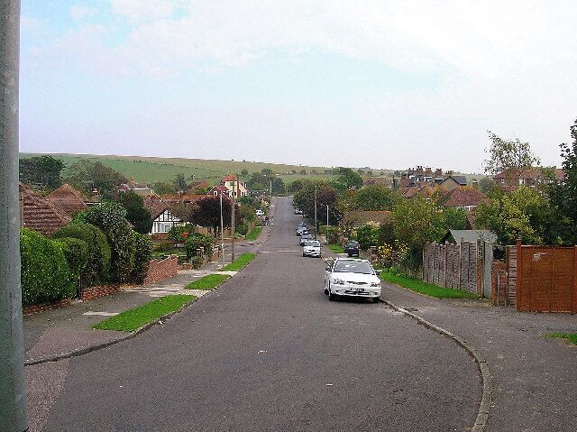 Court Ord Road, Rottingdean. Looking east towards its junction with Falmer Road (B2133). The square ends just beyond the ridge of the downs beyond.