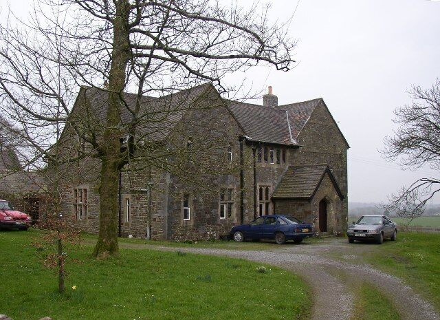 Ludchurch Rectory. The former Rectory, now Tall Trees, was built in 1868 in Victorian Gothic style using red and green sandstone, silver limestone and bands of Bath stone