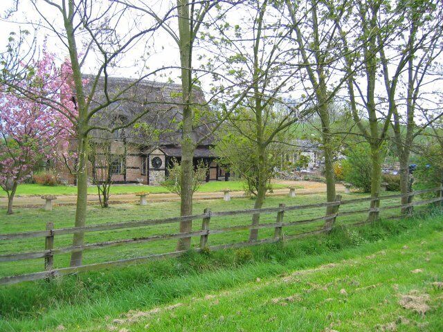 Barrow Hill Farm. The farm sits at the foot of Barrow Hill, a remarkably round hill (visible through the trees on the right of the picture) but too large to be man-made.