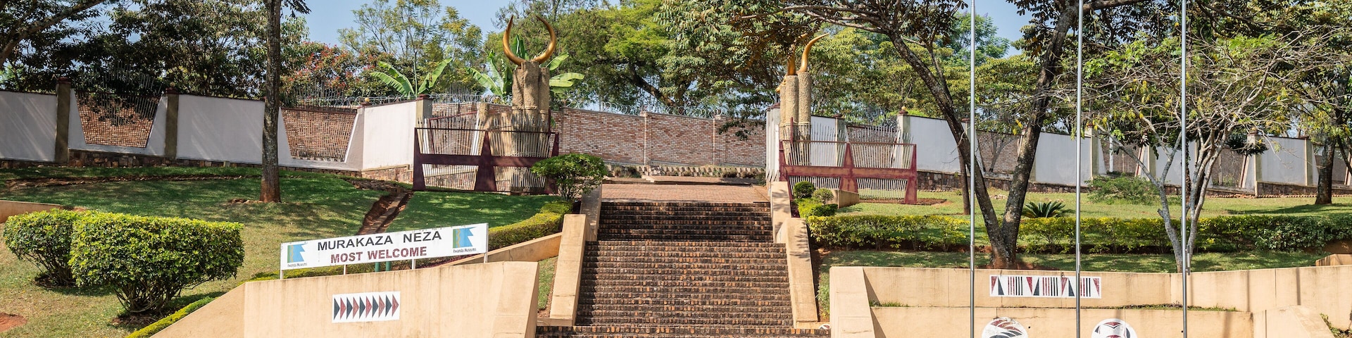 A set of stairs leading up to a building with a sign that reads "MURAKAZA NEZA MOST WELCOME".