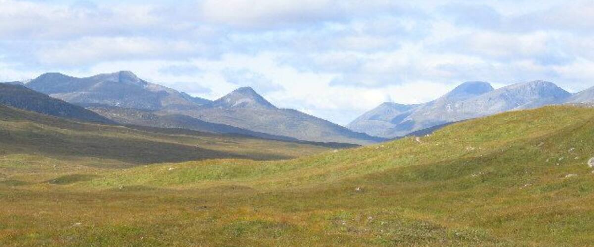 The Mamores, The Grey Corries and Ben Nevis from the Loch Ossian, Loch Treig Track. This follows the old Road to the Isles
