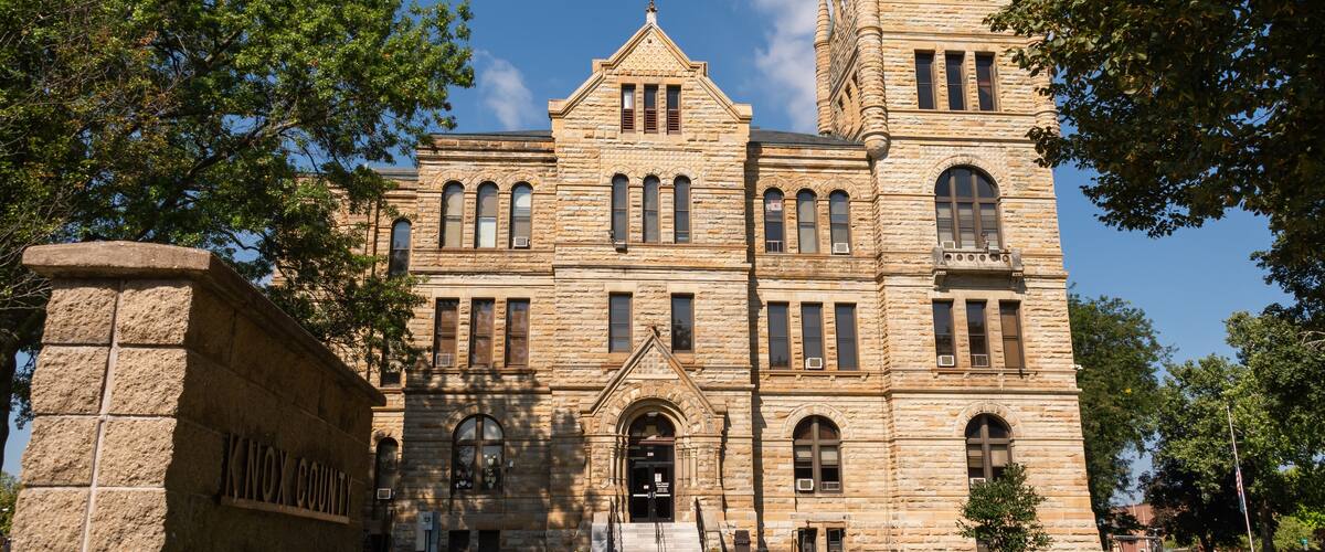 A historic courthouse with a clock tower and a sign reading "Knox County Court House."