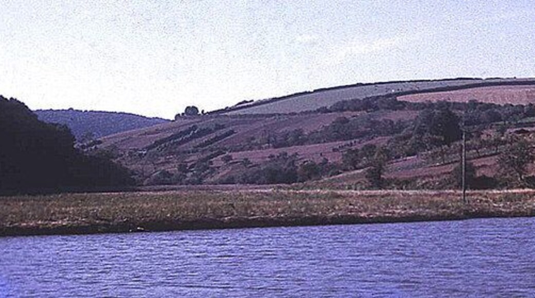 Tamar side valley to St Mellion View westwards from the river up the small side stream towards St Mellion. Typical of sunken estuaries, this very small stream has a relatively large valley, which is tidal for a mile from here. Strawberry Hill to the right and Hornifast Wood to the left. Ahead is some prime steep south-facing Tamar valley market gardening land - here still active in 1971, but today mostly reverted to scrub and farmland. This rural setting was not so tranquil in the war... http://www.bbc.co.uk/ww2peopleswar/stories/89/a5726289.shtml