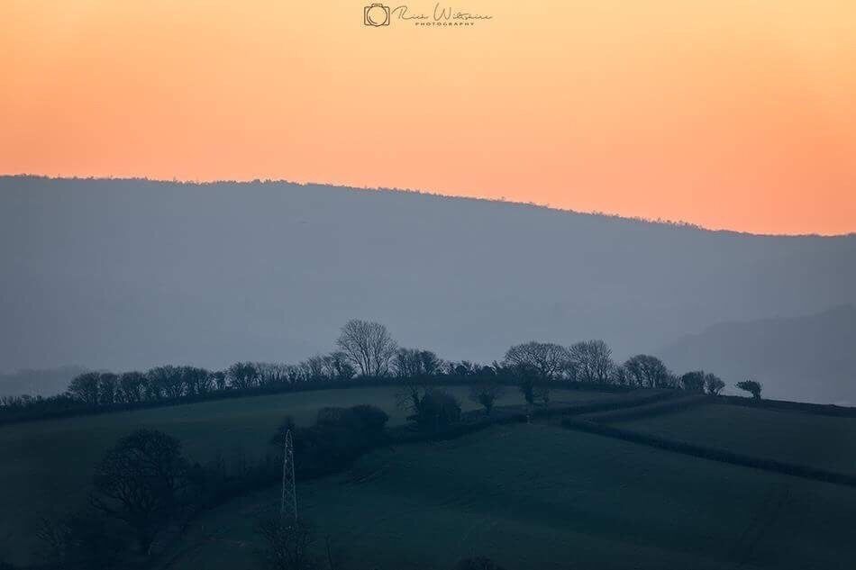 Misty sunset over the Quantock Hills in Somerset 