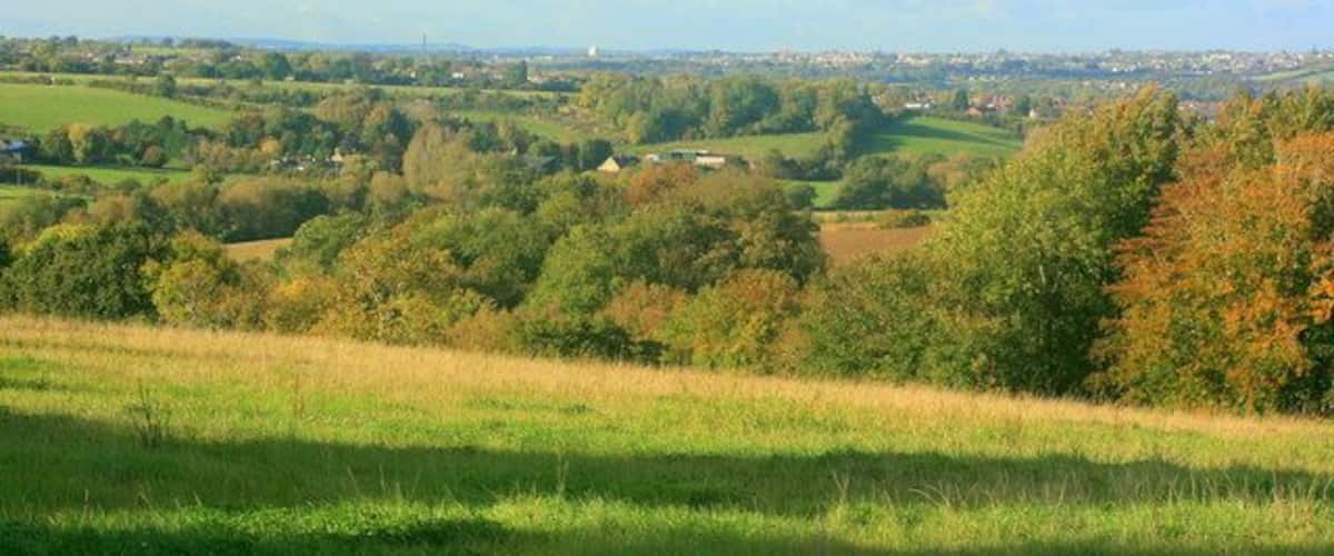 North from the road to Compton Dando Burnett lies to our right, Compton Dando to our left. East Bristol sprawls across the hill.