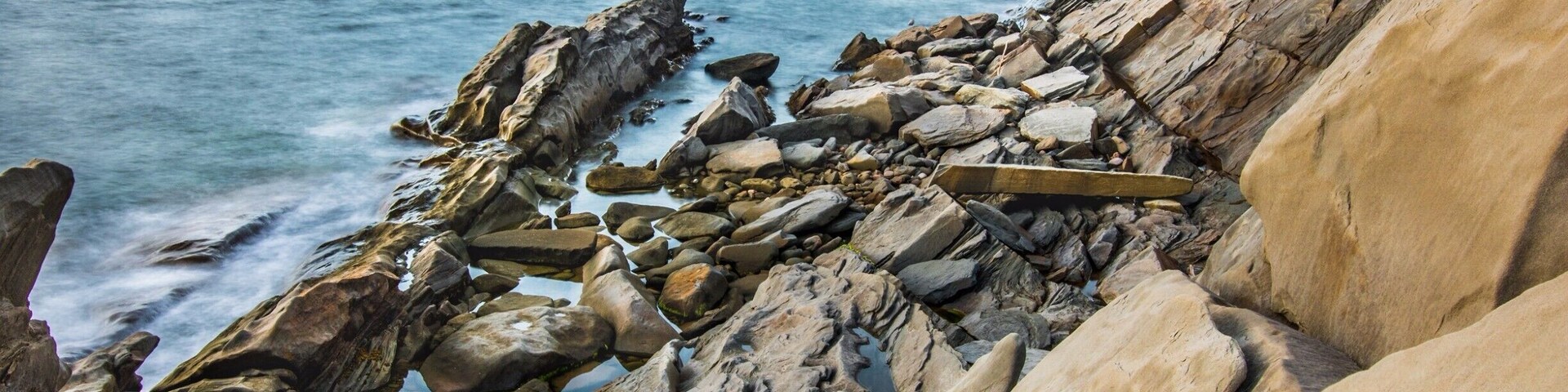 Rock formation lit by the sunset on our way to Cape Breton National Park. Make sure you have a good pair of shoes because you will need to go down a slope to get close to sea level. After that tons of cool photo to be discover. #BVStrove