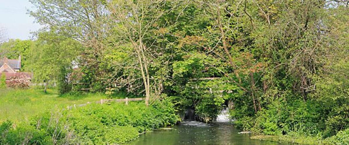 Weir on River Meon at Exton Seen from the garden opposite The Shoe pub.
