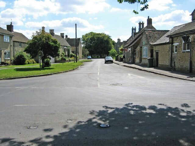 Market Overton, Rutland. Main Street: small stone cottages, large houses and the village post office and shop