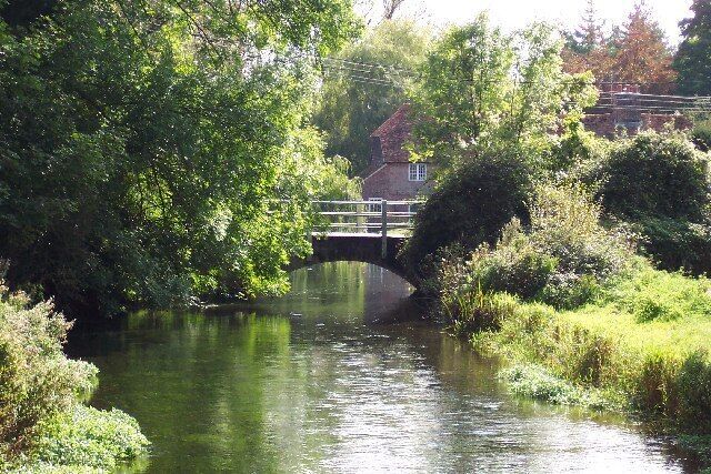 River Test at Fullerton. Taken from the old railway bridge over the River Test, looking south towards Fullerton Bridge and the old mill beyond.