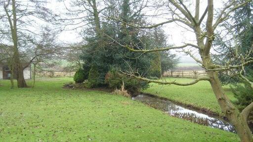 Tributary of Edingley beck Passing through a private garden