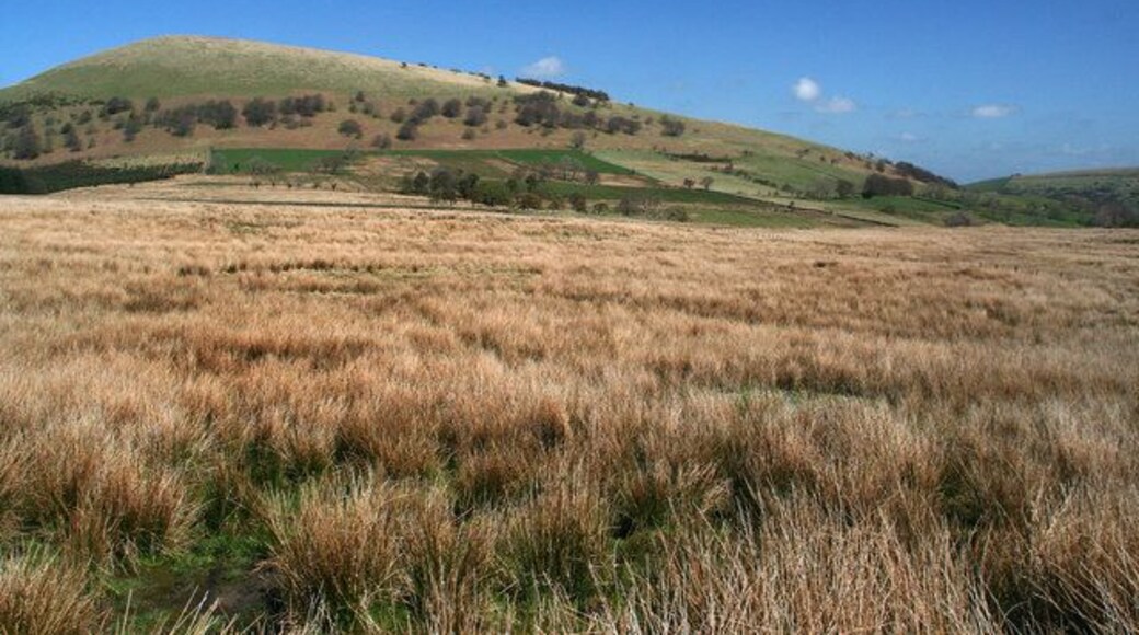 Great Mell Fell View from Binks Moss looking across rough pasture towards Racy Cottage at the foot of Great Mell Fell.
