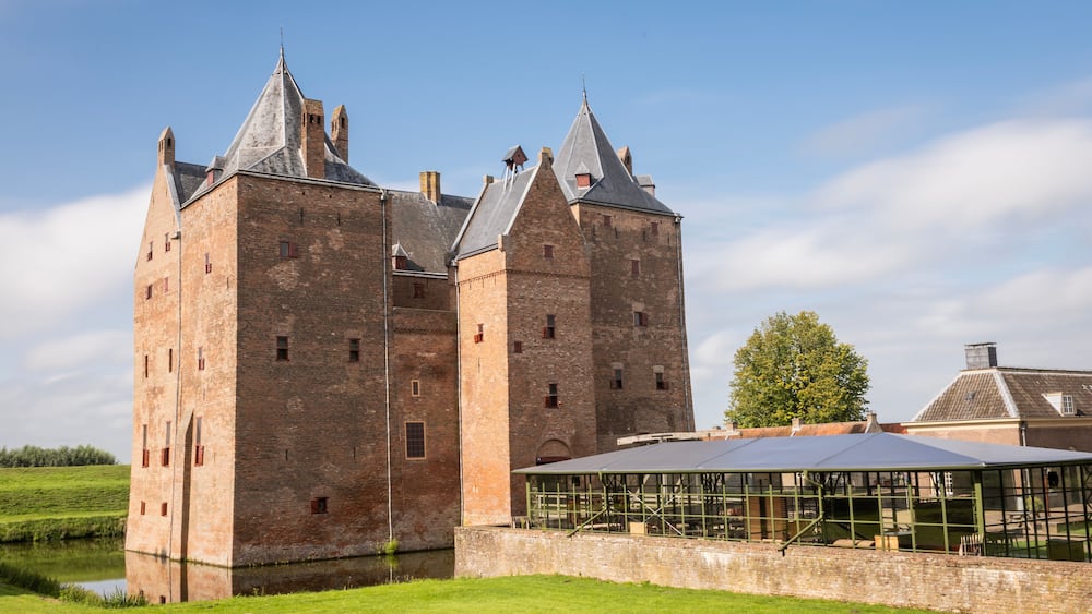 Slot Loevestein castle fort. medieval building used by military as a base as well as a state prison is now a museum and function centre for public access. historical landmark on sunny summer day