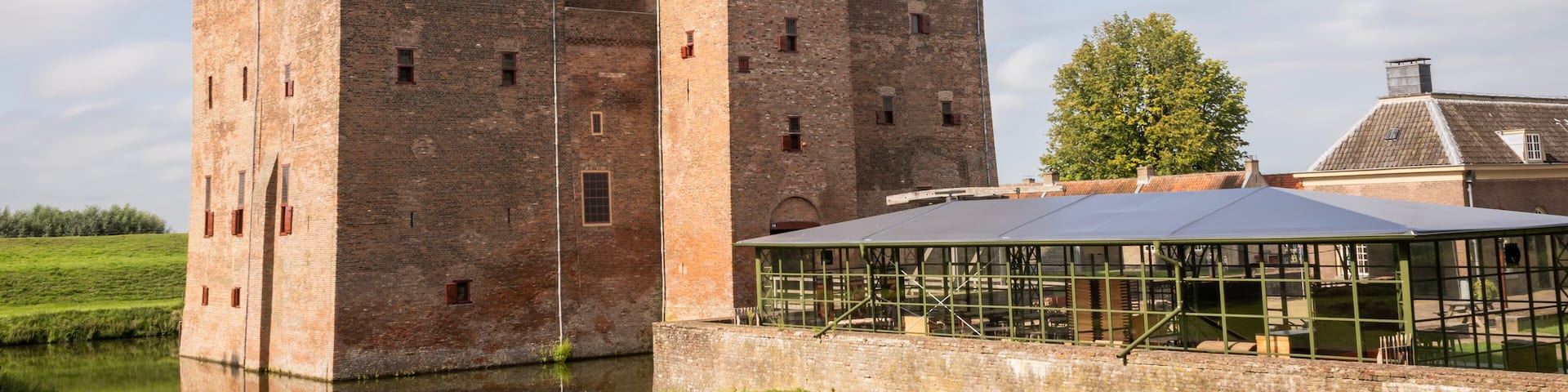 Slot Loevestein castle fort. medieval building used by military as a base as well as a state prison is now a museum and function centre for public access. historical landmark on sunny summer day