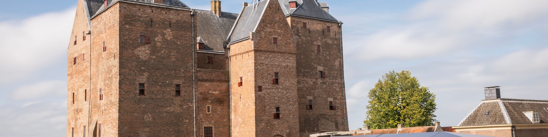 Slot Loevestein castle fort. medieval building used by military as a base as well as a state prison is now a museum and function centre for public access. historical landmark on sunny summer day