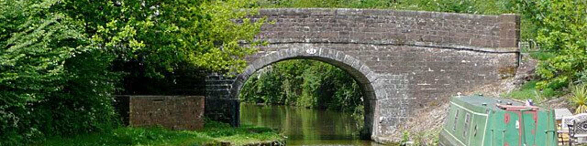 Bridge No 54, near Cheswardine, Shropshire. Westcottmill Bridge on the Shropshire Union Canal. The bridge is purely for farmers' access and a public footpath from the double bend on Westcott Lane on the left to Cheswardine on the right (1200 metres) where the Red Lion pub with its own microbrewery can be found. N.B. The footpath no longer goes through Westcott Mill Farm, but instead follows the concrete road adjacent to the canal.