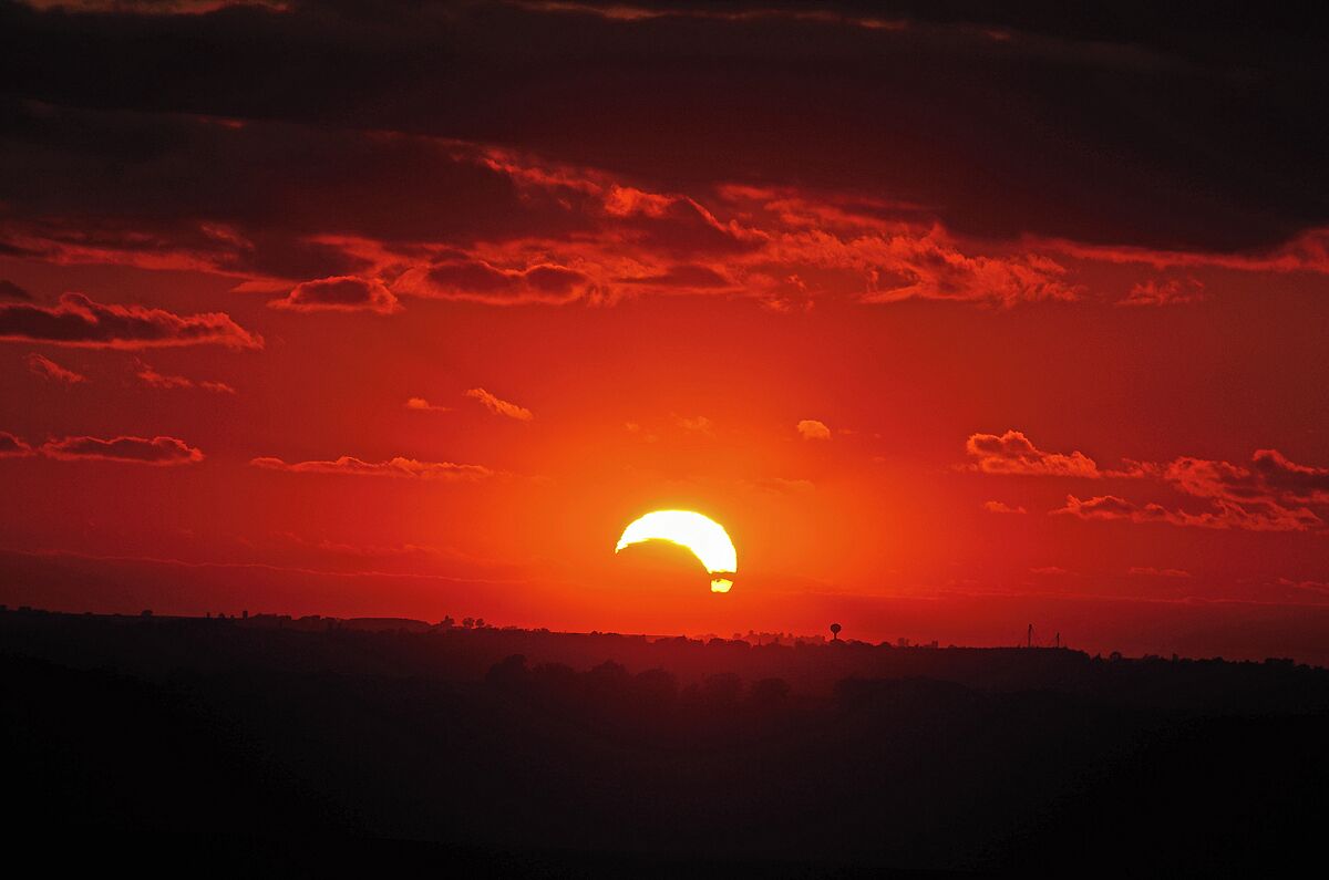 A picture of the eclipse at sunset from last year at Charles Mound which is the highest point in Illinois. 