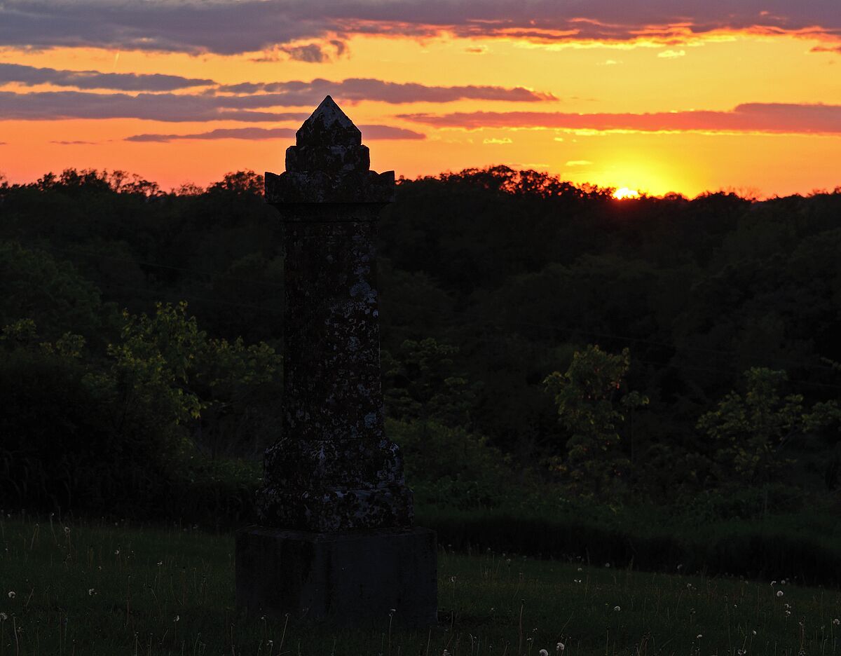 An old gravestone from the 1840s at a beautiful old cemetery with 20 head stones. They must have selected this little hill as a burial sight because of the great sunsets. 