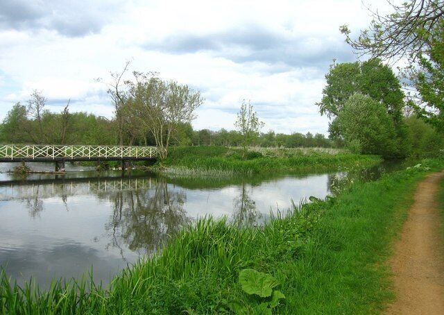 Where the waterway divides To the left is a weir, to the right runs the Kennet & Avon Canal.