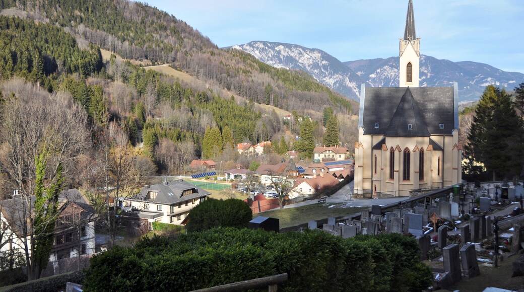 Church and cemetery in the alpine village Prein an der Rax. Austria
