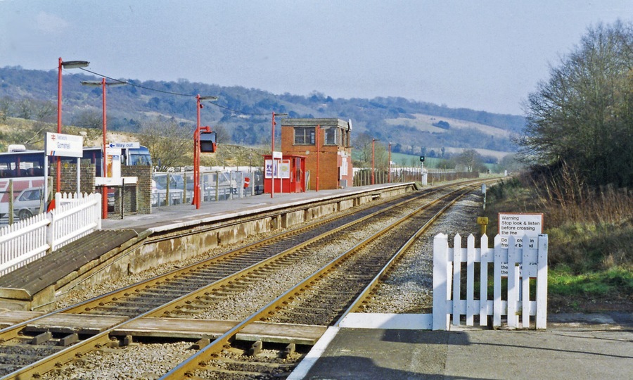 Gomshall station, eastbound platform 1993. View eastward, towards Redhill: ex-SE&CR Redhill - Guildford - Reading secondary main line. 'Gomshall & Shere' until 12/5/80, this station has staggered platforms withe westbound behind the camera. The North Downs are prominent in the background