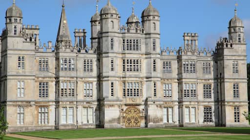 A large, historic building with multiple towers and a central entrance.