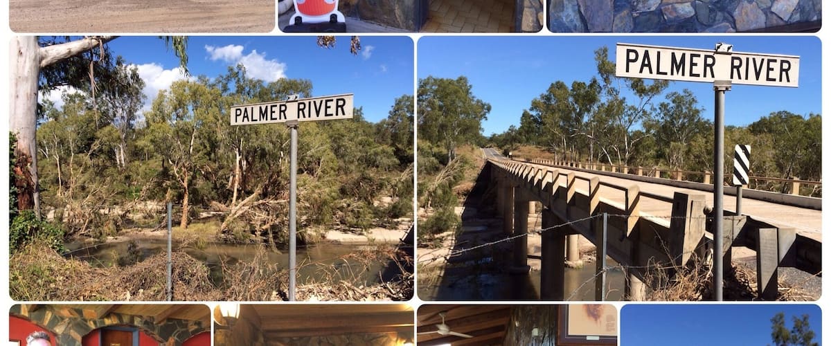 A rustic building with a sign reading "The Mighty Palmer River Road House," a street sign for Palmer River, a stone bridge, and a café interior.