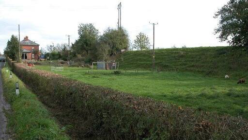 Stanley House, Dymock. Just north of Dymock is Stanley House. On the right of the picture is an embankment though I am not sure if it was for a railway. The course of the old Gloucester to Ledbury line is just beyond the house.