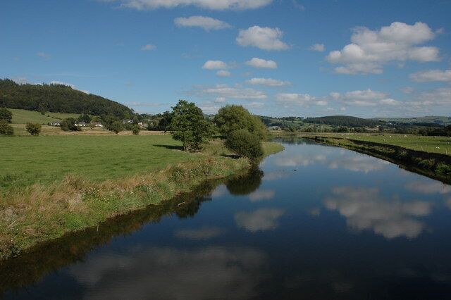The River Severn near Aberhafesp The River Severn viewed from the Festival Bridge, a suspension bridge carrying a footpath. Houses in the small village of Aberhafesp can be seen to the left in the middle distance. Here the river is only some thirty miles from its source and already it is quite wide.