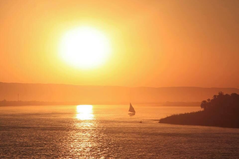 Peaceful night cruising down the Nile as a felucca sails by in the distance. A night ride on the sleeper train from Cairo to Luxor brought us to this cruise ship sailing through Luxor, Edfu, and ending in Aswan. Marvel at the very sight that ancient Egyptians  enjoyed ages ago and let yourself get lost in history and the beauty of the moment. #goldenhour 