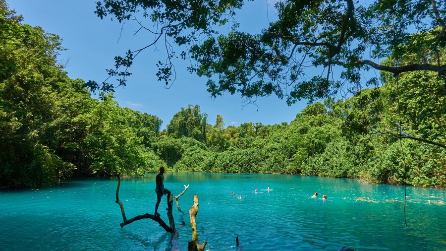 Malo Island which includes swimming and a lake or waterhole as well as a small group of people