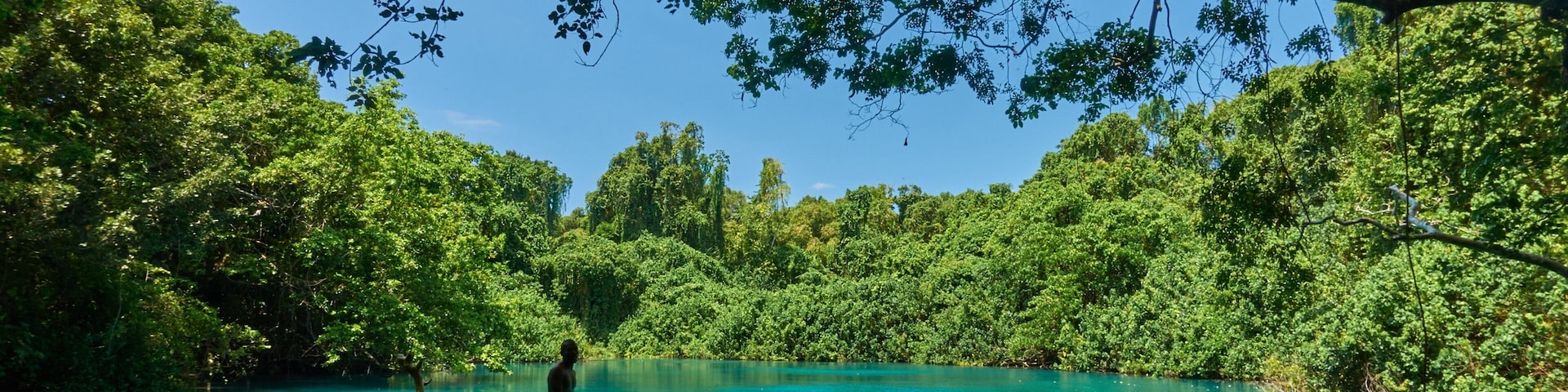 Malo Island which includes swimming and a lake or waterhole as well as a small group of people