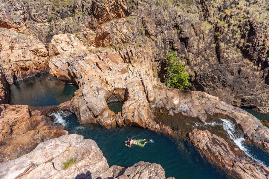 Rock pool at the Barramundi falls, Kakadu National Park, Northern Territory, Australia, one of the crocodile fre lakes in this area, where swimming is possible, Shutterstock ID 1112725160, Purchase Or