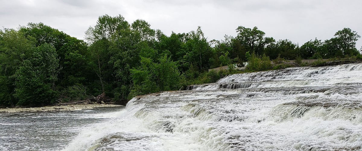 A rocky waterfall with cascading water.
