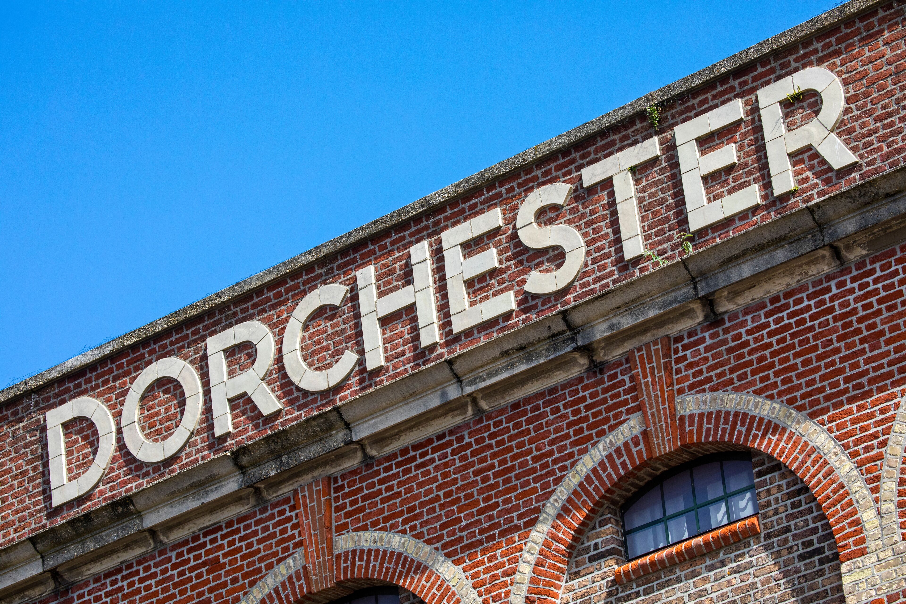 A brick building with the word "DORCHESTER" in large letters.