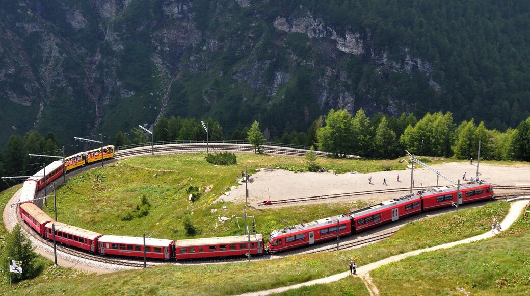 Switzerland, Graubünden, a North bound regional train with a new ABe 8/12 is entering Alp Grüm station