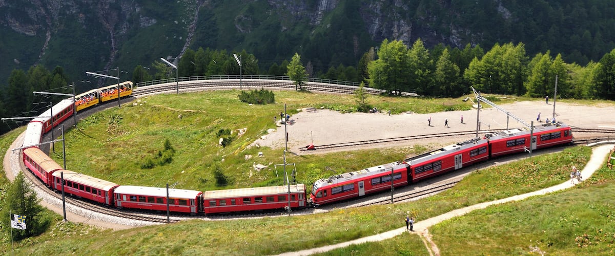 Switzerland, Graubünden, a North bound regional train with a new ABe 8/12 is entering Alp Grüm station